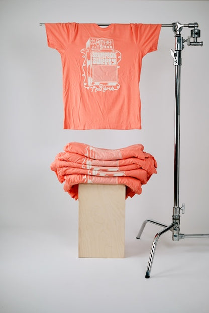 Coral tee with ivory ink